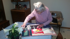 Imogene working on a fidget quilt. On average, she sews about one quilt a day.